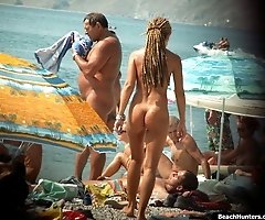 Spicy voyeur shots of beach nudity made near the sea
