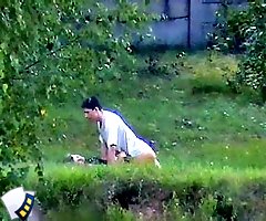 Clothed couple enjoy some pounding on the grass